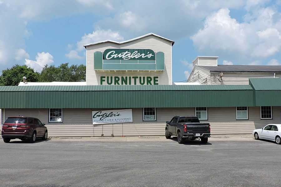 store front of gutzler's furniture and flooring